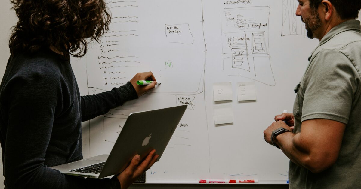 Performance Development Image of two people in a coaching session